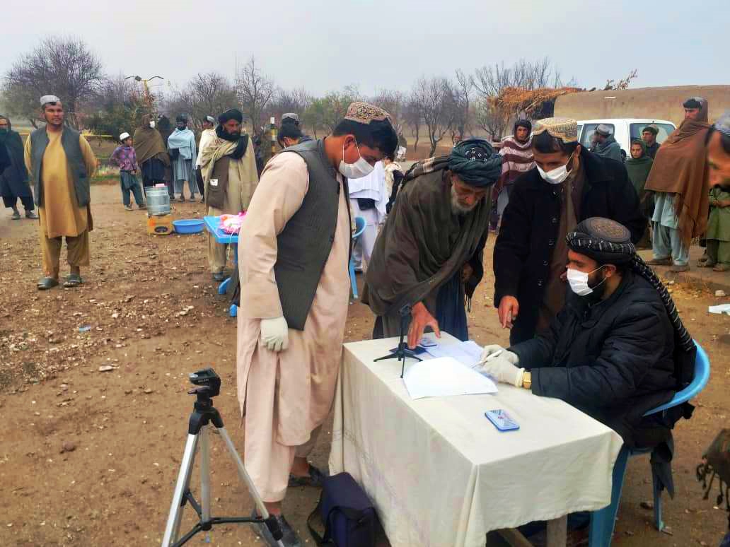 Beneficiaries put finger print for verification purposes in Kandahar province