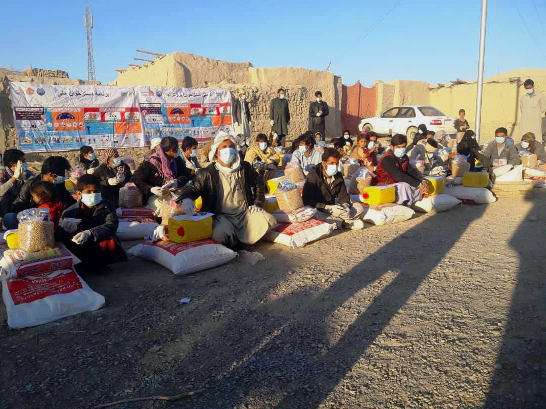 Villagers recieving the Relief Packages under Dastarkhwan-e Meli
