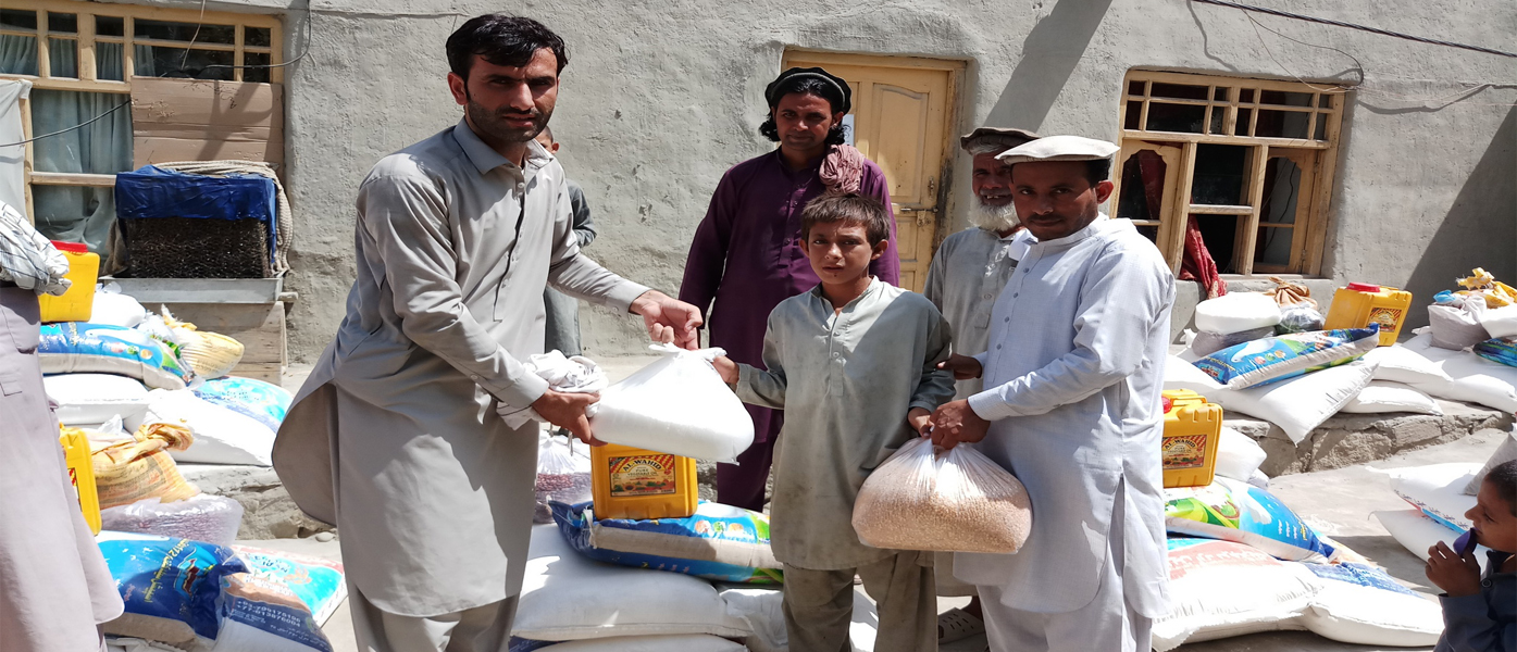 Vulnerable families receive food items from a Grain Bank, Khalisa village, Kama district, Nangarhar province